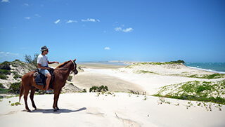 Horseback riding on private island at Azura Benguerra