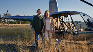 Couple after a helicopter safari around the Okavango Delta
