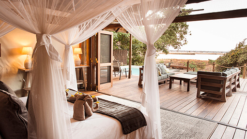 Bedroom and deck of Chiawa Camp safari tent