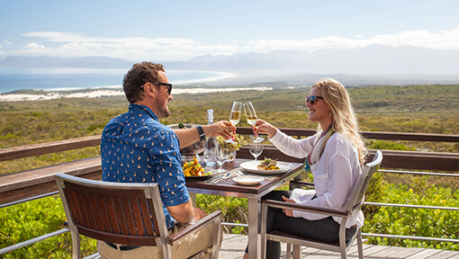 Couple eating lunch on the deck of Grootbos Private Nature Reserve