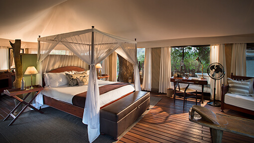 Bedroom of tented suite at andBeyond Kanga Camp