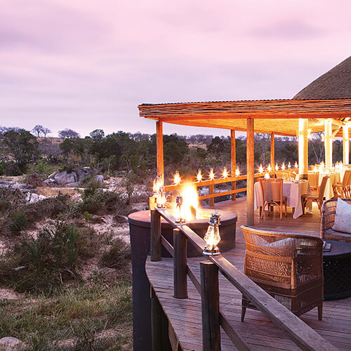 Candlelit dining deck of Londolozi founders camp