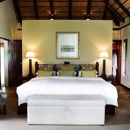 Bedroom in superior chalet at Londolozi Varty camp