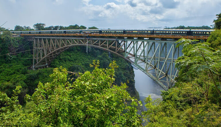 Rovos Rail train crossing bridge between Zambia and Zimbabwe at Victoria Falls