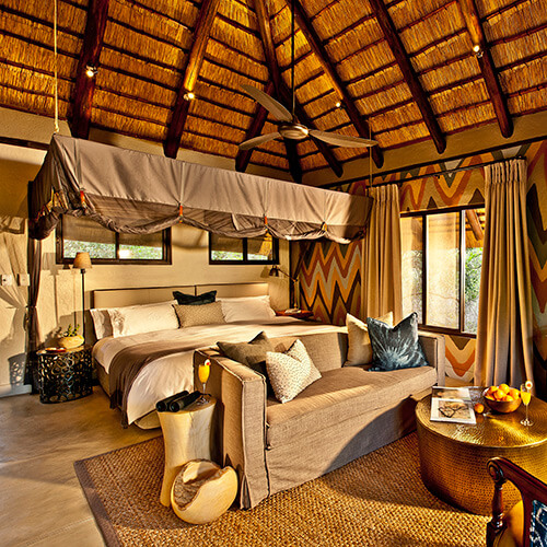 Bedroom of luxury suite at Sabi Sabi Little Bush Lodge
