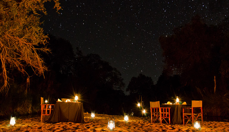 Nighttime dining under the stars at Sabi Sabi Little Bush Lodge