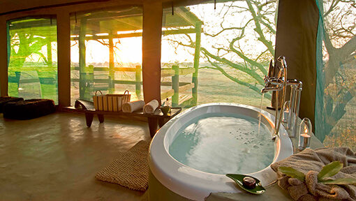 Bathroom of luxury tented safari suite at Sanctuary Puku Ridge Camp