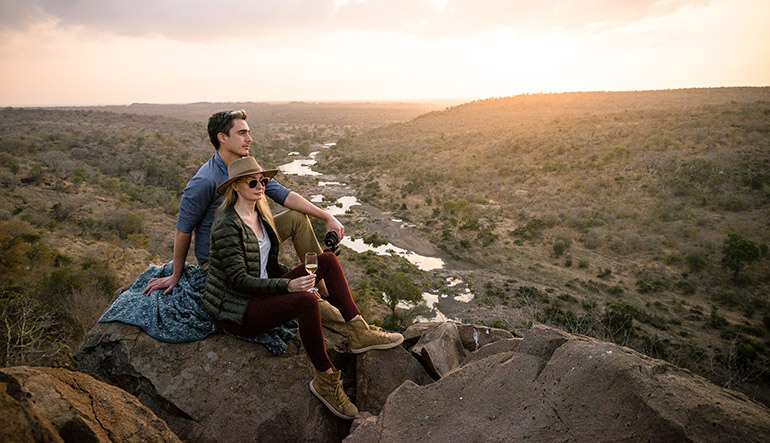 Couple watching sunset in Kruger National Park