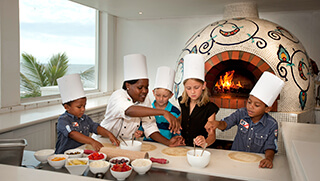Children making pizza with chef at The Oyster Box
