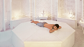 Woman relaxing in the Hamman at The Oyster Box spa