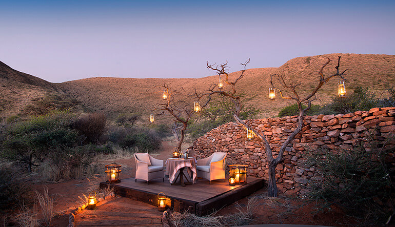Candlelit boma dining at Tswal Kalahari