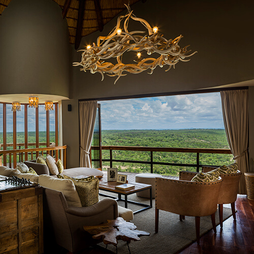 Bedroom with a view of the bush at Ulusaba Cliff Lodge
