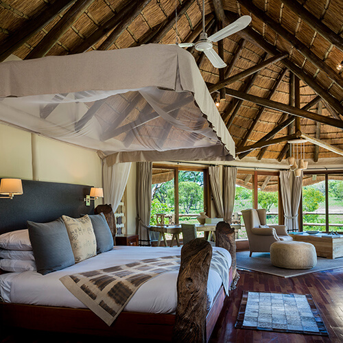 Bedroom of river room suite at Ulusaba Safari Lodge