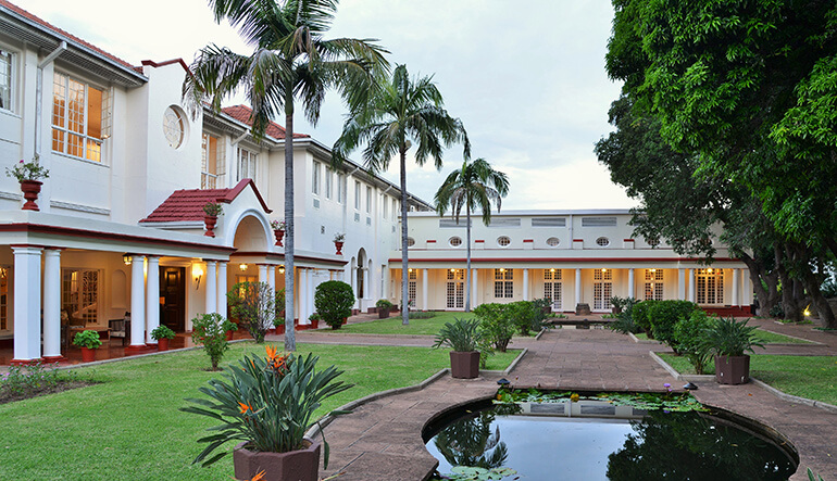 Pond and courtyard of Victoria Falls Hotel