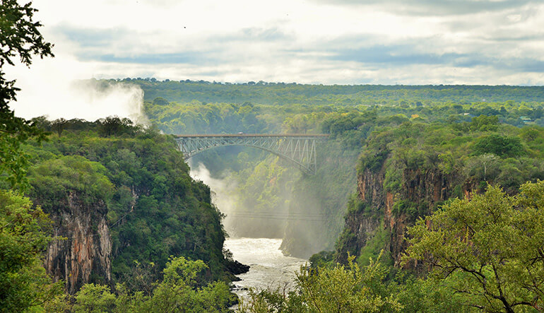 View of Victoria Falls and bridge from Victoria Falls Hotel