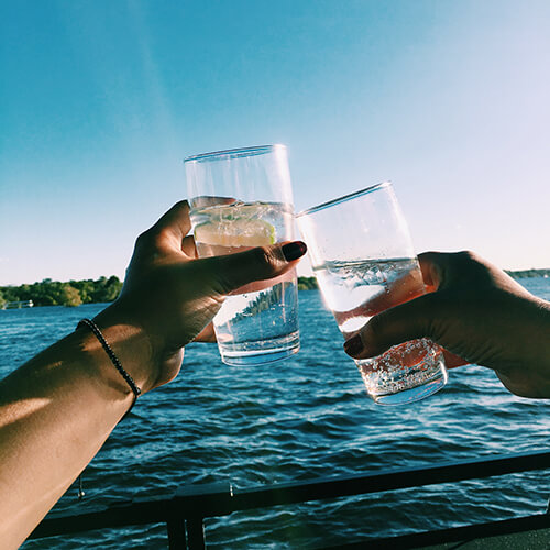 Gin and tonic cocktails during a sunset cruise on the Zambezi River