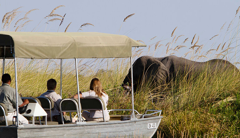 Couple enjoying a water safari in the Okavango Delta
