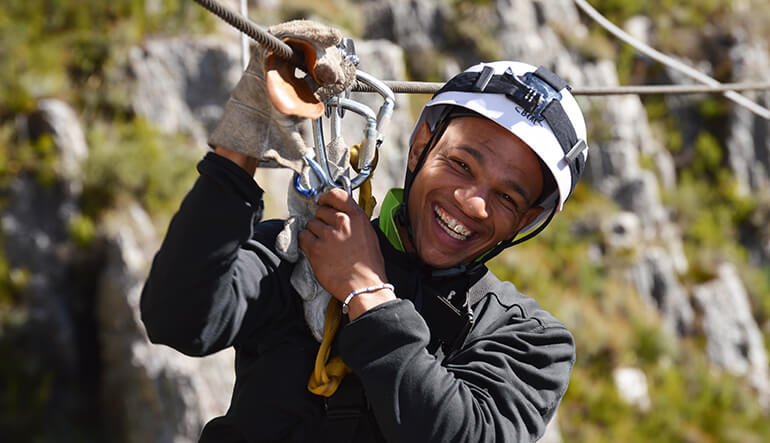 Man zip-lining during a Cape Canopy Tour in Elgin