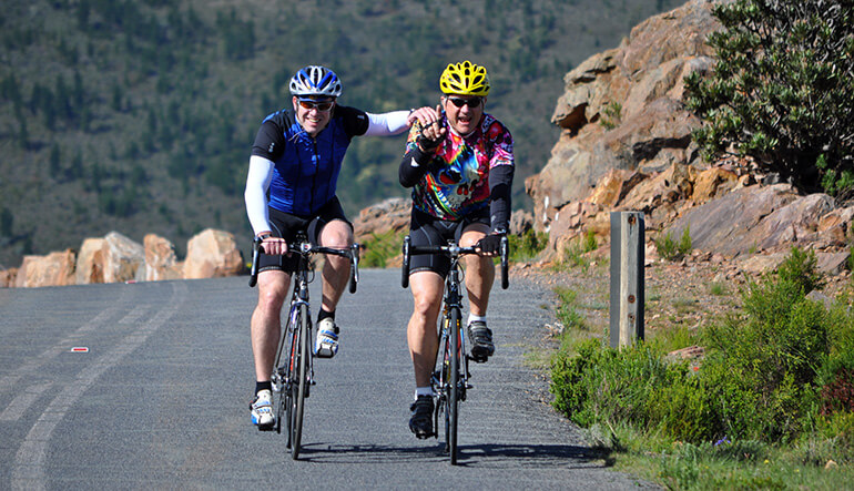 Two men enjoying a cycling tour in the Cape Winelands