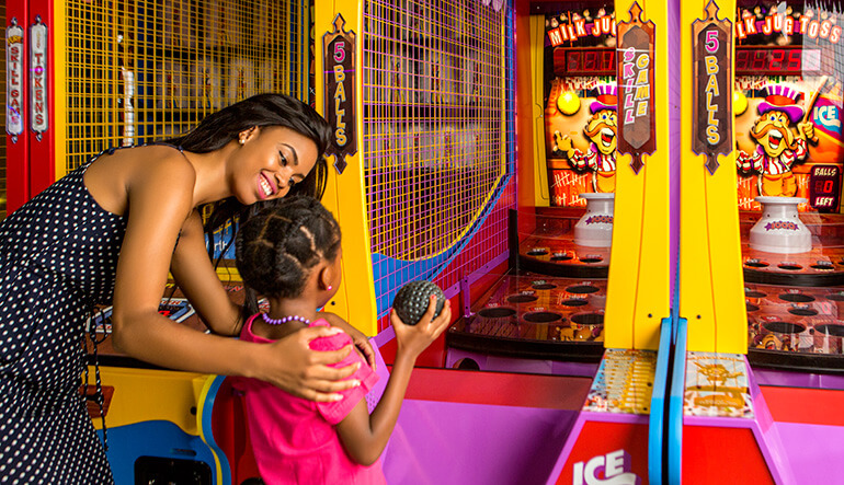 Mother and daughter playing arcade games at Sun City in Johannesburg