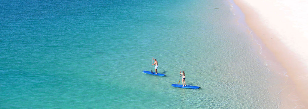Couple Stand Up Paddle Boarding at Azura Benguerra Mozambique