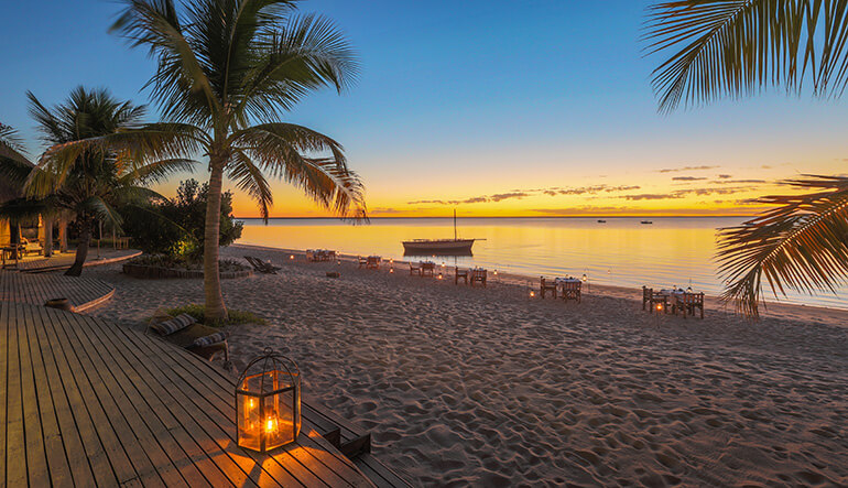 Sunset beach dining at Azura Benguerra Mozambique