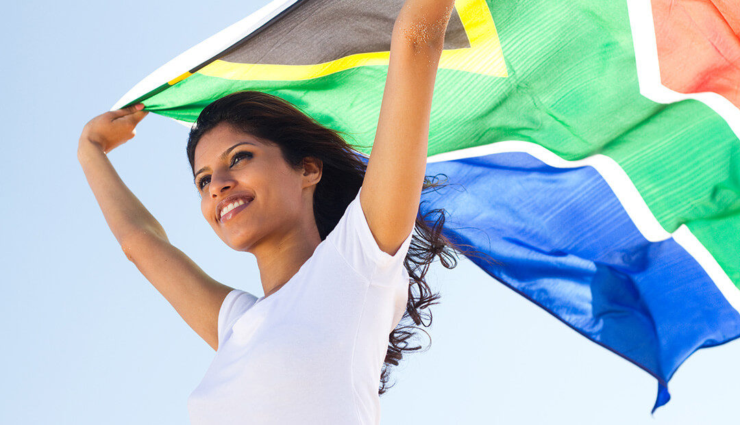 Woman holding South African flag