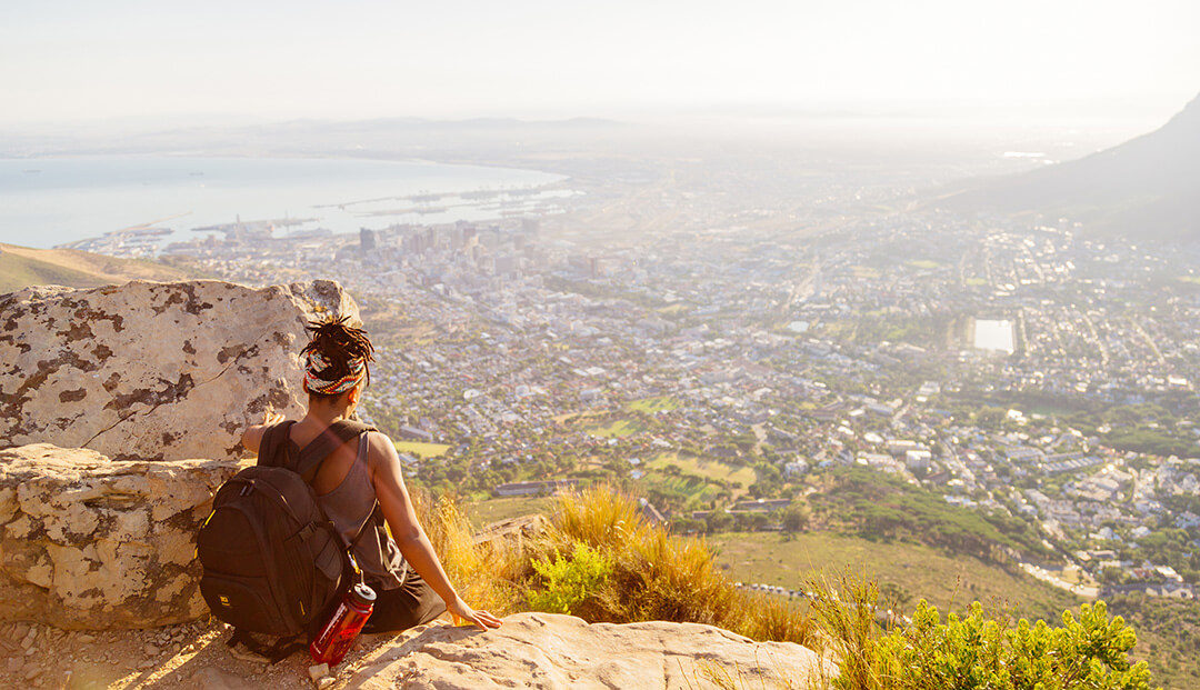 Girl looking at Cape Town city from Lions Head