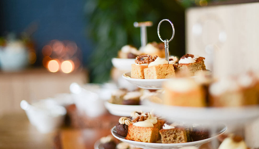Cakes on cake stand display during a high tea or afternoon tea service