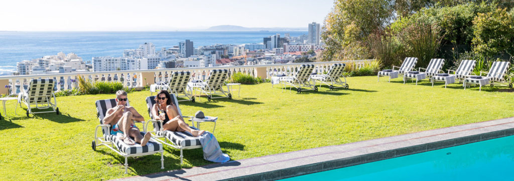 Couple relaxing at the pool of Ellerman House