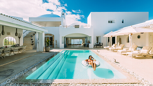 Woman relaxing in the pool at Santorini Mozambique