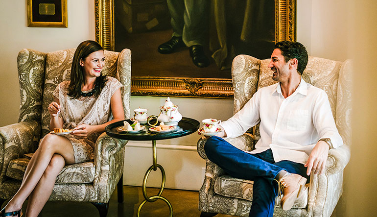 Couple enjoying high tea at the Royal Livingstone Hotel