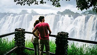 Couple looking at Victoria Falls