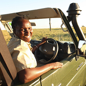 Safari guide in game vehicle at andBeyond Kichwa Tembo Camp in Kenya