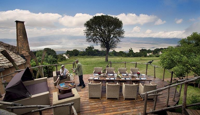 Woman relaxing at the deck of andBeyond Ngorongoro Crater Lodge