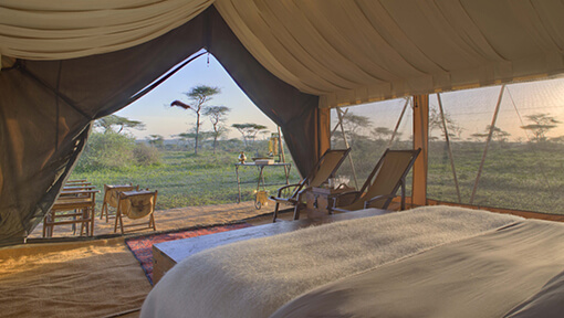 Inside a luxury tented suite at andBeyond Serengeti Under Canvas