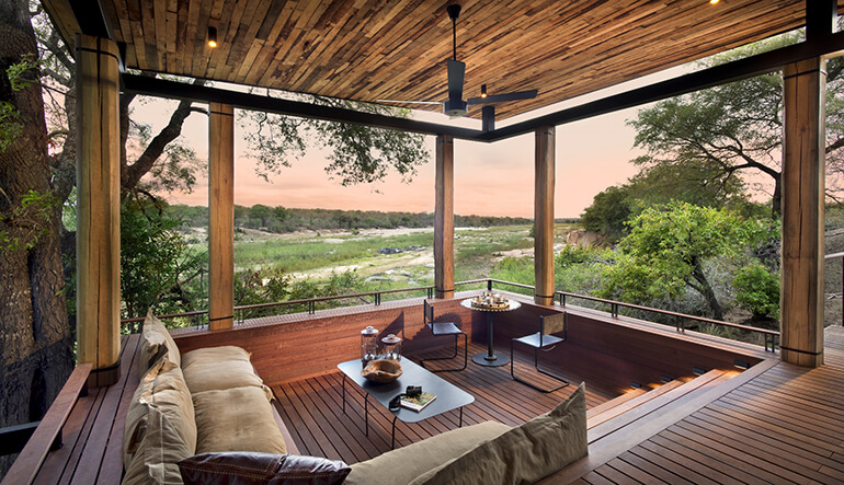 Outdoor seating at suite of andBeyond Tengile River Lodge