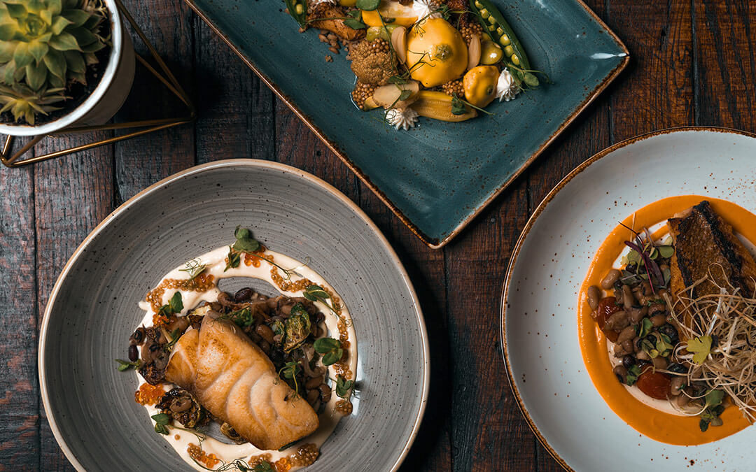 Flat lay of plates of food at fine dining restaurants